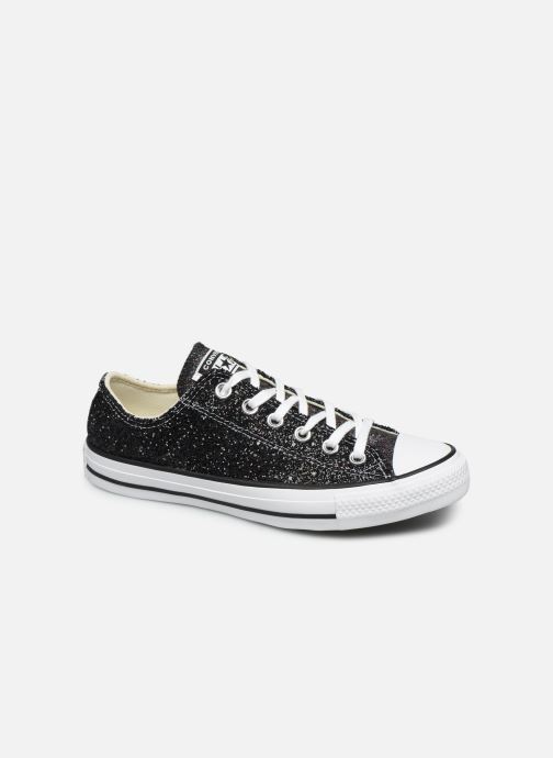 white converse with black writing