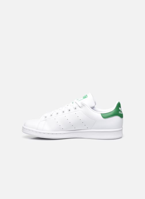 white adidas with green heel